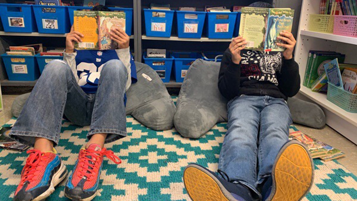 school students read books