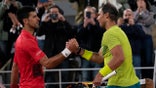 Serbia's Novak Djokovic, left, congratulates Spain's Rafael Nadal who won the quarterfinal match in four sets, 6-2, 4-6, 6-2, 7-6 (7-4), at the French Open tennis tournament in Roland Garros stadium in Paris, France, Wednesday, June 1, 2022.