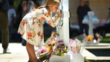 Eight year old girl signs memorial