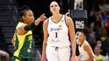 SEATTLE, WASHINGTON - MAY 20: Briann January #20 of the Seattle Storm and Liz Cambage #1 of the Los Angeles Sparks react during the first half at Climate Pledge Arena on May 20, 2022 in Seattle, Washington.