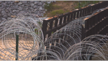The Texas National Guard installed concertina wire along the Rio Grande River.