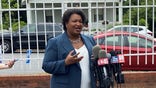 Stacey Abrams speaks wtih reporters on primary day in Georgia