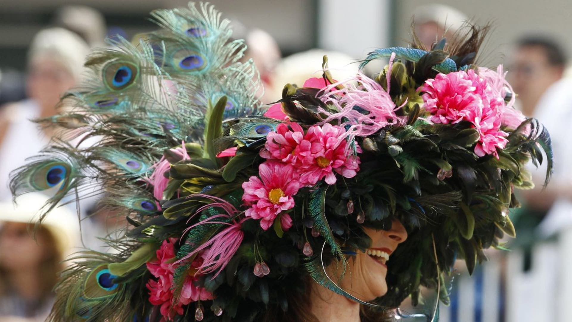 Kentucky Derby hat adorned with flowers and peacock feathers