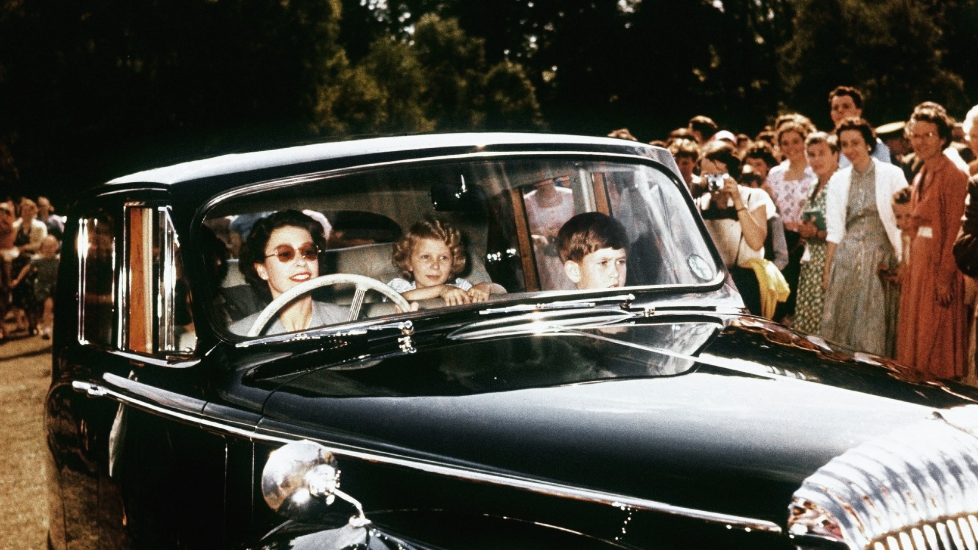 Queen Elizabeth driving Prince Charles, Princess Anne