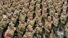 Russia moves forces to Mariupol ahead of 'Victory Day' parade, officials work to rescue trapped troops