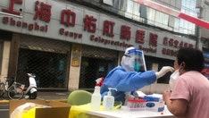 Recent spike in China's COVID-19 cases sees Shanghai promote new booster doses through a straw