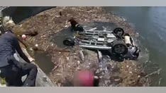 New Jersey police rescue woman from SUV submerged in Delaware River