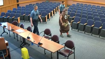 Maryland county council meeting disrupted by man in 'poop emoji' costume with stink bomb
