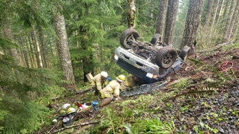 Oregon firefighters rescue 2 trapped in vehicle after rollover crash in remote area
