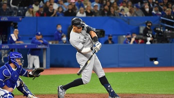 Young Yankees fan hugs Blue Jays fan after he's gifted Aaron Judge home run ball in stands