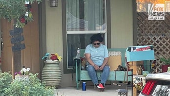 Texas school shooting suspect's mother seen praying on front porch of her parents' home