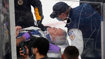 NHL official carted off ice after glass falls on him during Bruins-Hurricanes Game 3