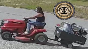 Alabama police seeking masked woman caught on camera stealing lawnmower with Crimson Tide yard sign