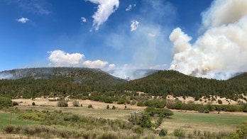 As weather shifts, fire in New Mexico nears 50% containment