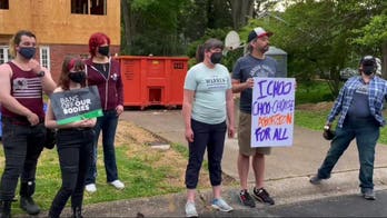 Small groups of protesters show up at Supreme Court justices' homes to push for Roe v. Wade