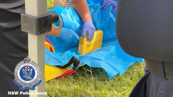 Australian police find diver's body near 110 pounds of suspected cocaine on riverbank