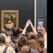 Mona Lisa left unharmed after apparent climate protest stunt