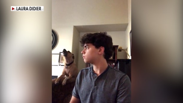 Zach Didier playing the piano with his dog Jack in the background before Zach died from a fentanyl overdose two days after Christmas in 2020.