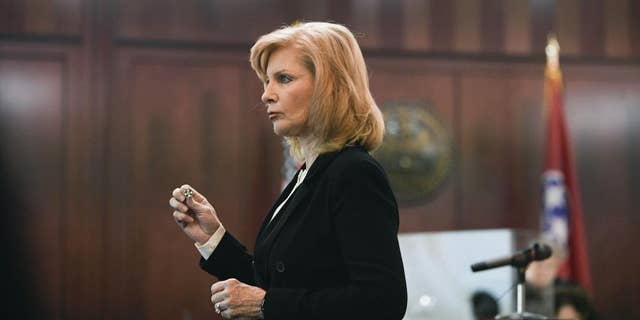 Assistant District Attorney Debbie Housel shows a nurse pin to the jury, a symbolic pin for newly graduated nurses during the opening statements in the trial of ex-Vanderbilt nurse, RaDonda Vaught, at Justice A.A. Birch Building in Nashville, Tenn., Tuesday, March 22, 2022. 