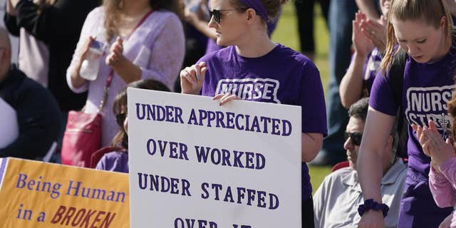 People demonstrate outside the courthouse where the sentencing hearing for former nurse RaDonda Vaught is being held Friday, May 13, 2022, in Nashville, Tenn.