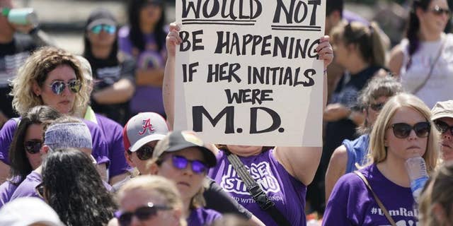 People demonstrate outside the courthouse where the sentencing hearing for former nurse RaDonda Vaught is being held Friday, May 13, 2022, in Nashville, Tenn.