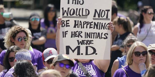 People demonstrate outside the courthouse where the sentencing hearing for former nurse RaDonda Vaught is being held Friday, May 13, 2022, in Nashville, Tenn.