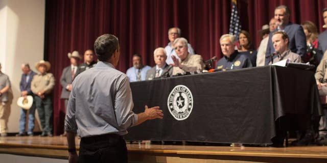 Democrat Robert "Beto" O’Rourke, who is running against Abbott for governor this year, interrupts a news conference headed by Texas Gov. Greg Abbott in Uvalde, Texas Wednesday, May 25, 2022.