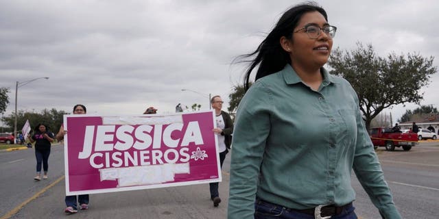 Democrat Jessica Cisneros, who is campaigning for a House seat, participates in the Citrus Parade to introduce herself in Mission, Texas, Jan. 25, 2020.