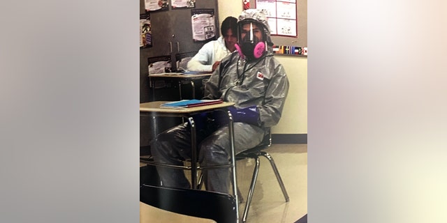 Payton Gendron in a hazmat suit.