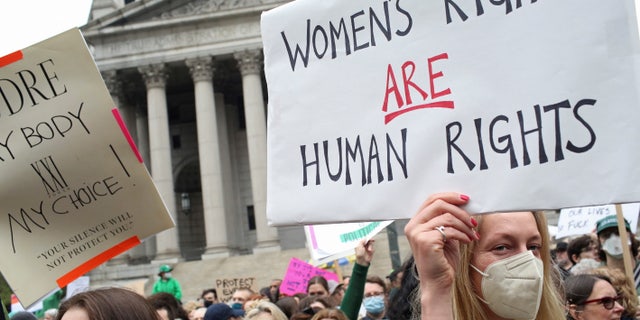 People protest after the leak of a draft majority opinion written by Justice Samuel Alito.