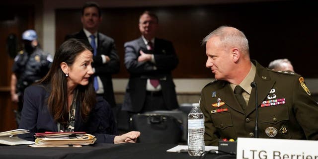 Director of National Intelligence (DNI) Avril Haines and Defense Intelligence Agency Director Lt. Gen. Scott Berrier confer before testifying in a Senate Armed Services Committee hearing on "Worldwide Threats" at the U.S. Capitol in Washington May 10, 2022.