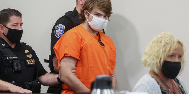 Buffalo shooting suspect, Payton S. Gendron, who is accused of killing 10 people in a live-streamed supermarket shooting in a Black neighborhood of Buffalo, is escorted in the courtroom in shackles, in Buffalo, New York, U.S., May 19, 2022.