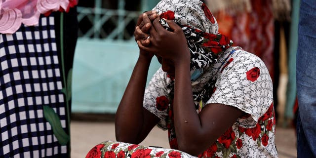 Diali Kaba, a mother of a 10-day-old baby girl, grieves outside the Mame Abdou Aziz Sy Dabakh hospital, in Tivaouane, Senegal, on May 26, 2022, after learning her newborn was included in the deadly blaze.