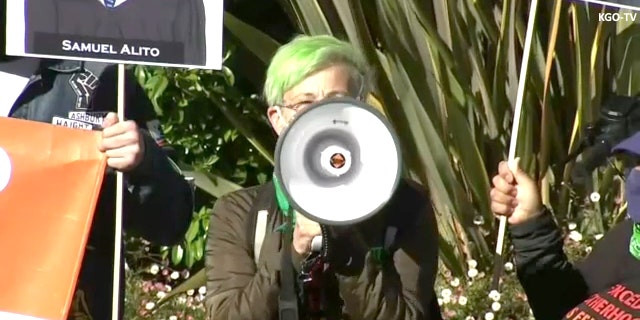 Pro-choice protester outside Nancy Pelosi's house. Credit KGO-TV.