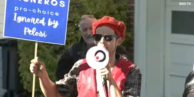 Pro-choice protester outside Nancy Pelosi's house. Credit KGO-TV. 