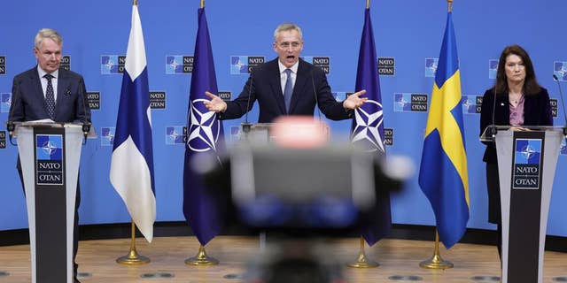NATO Secretary General Jens Stoltenberg, center, takes part in a press conference with Finnish Foreign Minister Pekka Haavisto and Swedish Foreign Minister Ann Linde at NATO Headquarters in Brussels on Monday 24 january.