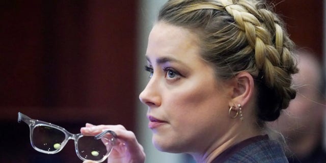 Amber Heard is reportedly "in talks" to write a tell-all book following her loss in court earlier this month against ex-husband Johnny Depp in their multi-million dollar defamation trial.
