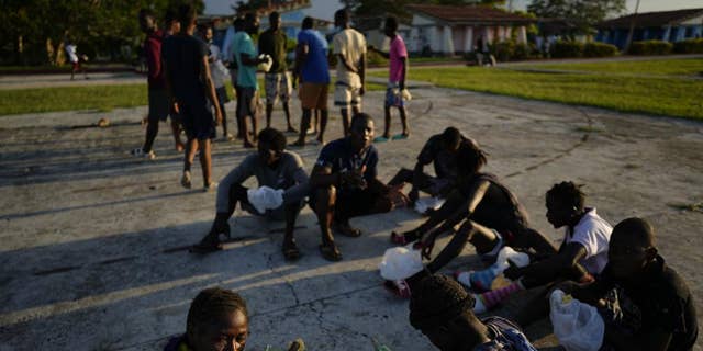 Haitian migrants eat at a tourist campground in Sierra Morena, in the Villa Clara province of Cuba Wednesday, May 25, 2022.