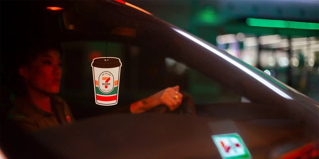 A 7-Eleven cofee-scented air freshener hands from the rearview mirror.