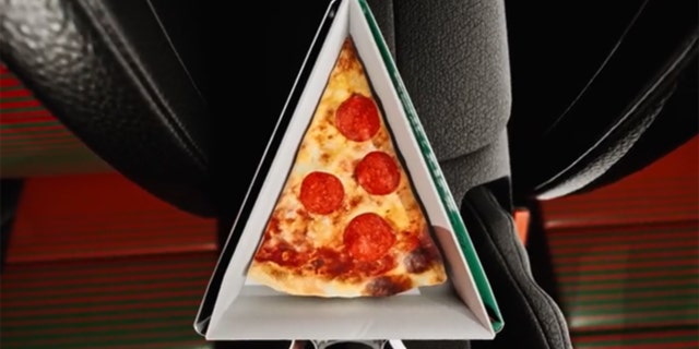 A pizza slice holder slides into the cup holder.