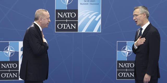 NATO Secretary General Jens Stoltenberg, right, greets Turkey's President Recep Tayyip Erdogan as he arrives for a NATO summit at NATO headquarters in Brussels, Monday, June 14. 