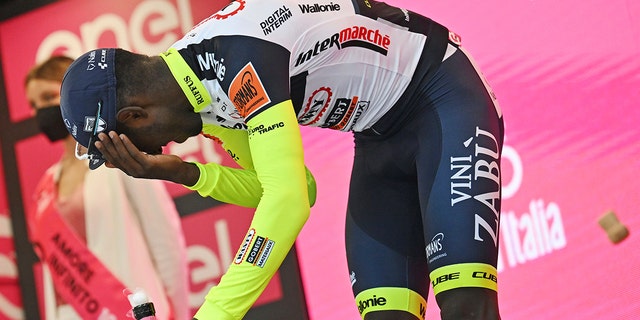 Eritrea's Biniam Girmay was then taken to a local hospital after getting injured when he popped a champagne cork into his eye during the podium celebration on Tuesday, May 17, 2022. 