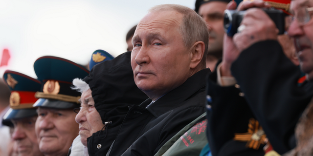 Russian President Vladimir Putin looks on during the Victory Day military parade marking the 77th anniversary of the end of World War II in Moscow, Russia, on Monday, May 9.