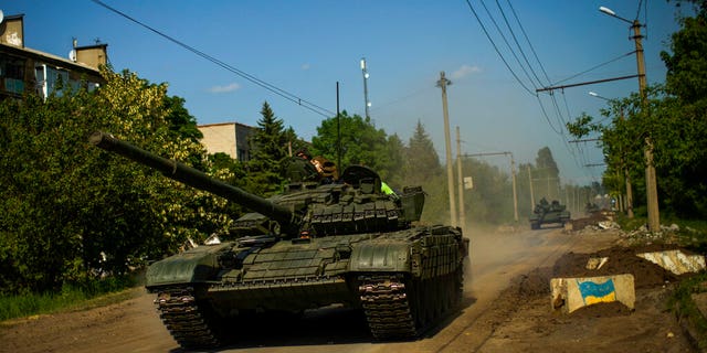 Ukrainian tanks move in the Donetsk region, eastern Ukraine, Monday, May 30, 2022. 