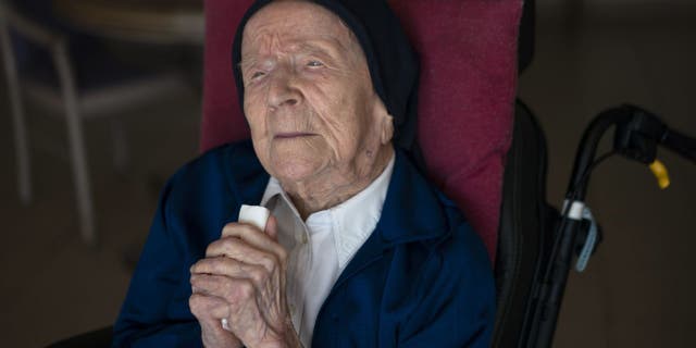 Lucile Randon, AKA Sister André, poses for a portrait at the Sainte Catherine Laboure care home in Toulon, southern France, on Wednesday, April 27, 2022, shortly after becoming the oldest person in the world.