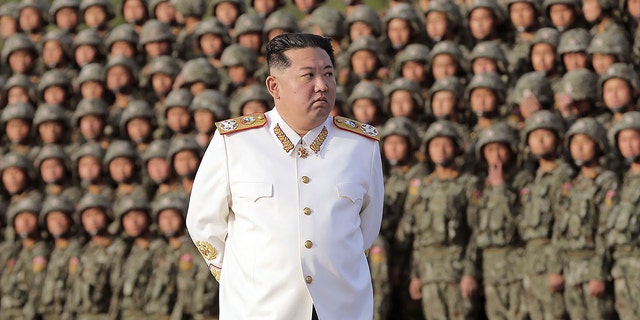 North Korean leader Kim Jong Un attends a photo session with the officers and soldiers who took part in a celebration the 90th founding anniversary of the Korean People's Revolutionary Army, in North Korea Wednesday, April 27, 2022.