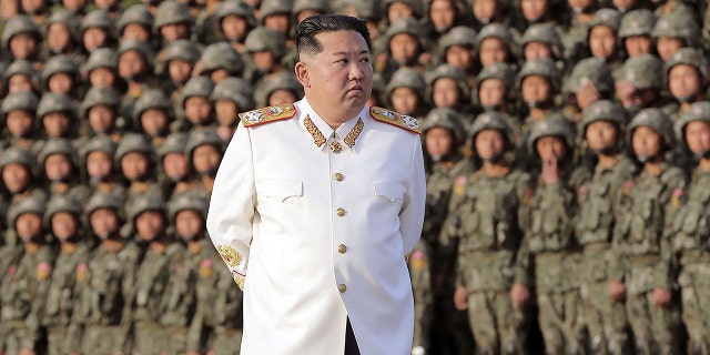 North Korean leader Kim Jong Un attends a photo session with the officers and soldiers who took part in a celebration the 90th founding anniversary of the Korean People's Revolutionary Army, in North Korea Wednesday, April 27, 2022.