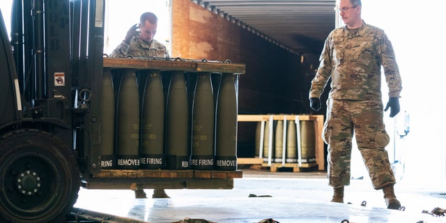 Airmen from the 436th Airport Squadron place 155mm shells on pallets of aircraft bound for Ukraine, Friday, April 29, 2022, at Dover Air Force Base, Del.