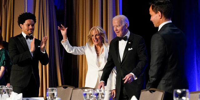 President Joe Biden and first lady Jill Biden arrive at the annual White House Correspondents' Association dinner, Saturday, April 30, 2022, in Washington. At left is comedian Trevor Noah.
