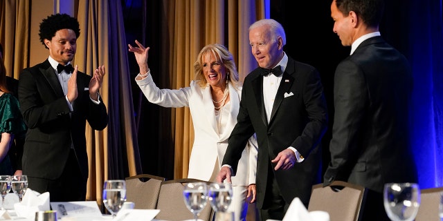 President Joe Biden and first lady Jill Biden arrive at the annual White House Correspondents' Association dinner, Saturday, April 30, 2022, in Washington. At left is comedian Trevor Noah. (AP Photo/Patrick Semansky)